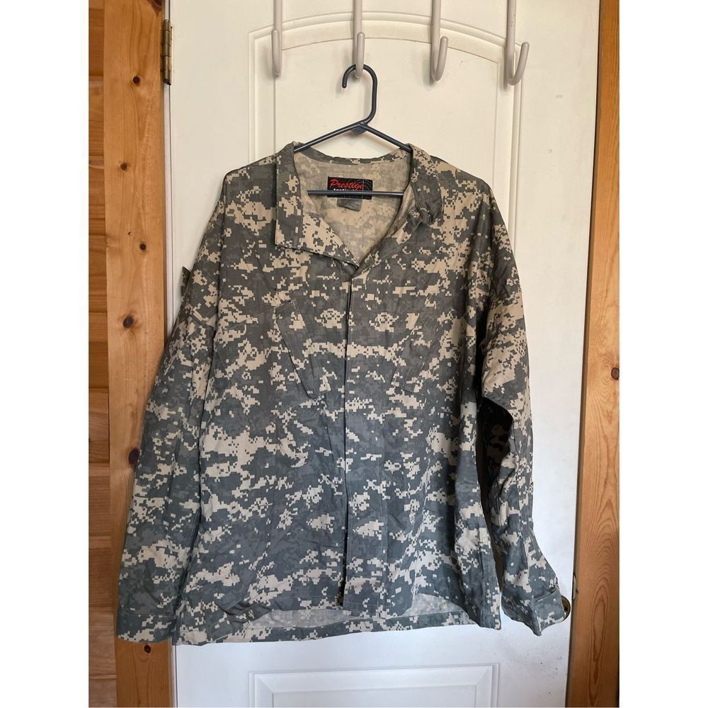 Prestige Tactical wear men’s XL Reg. camo shirt. Lots of pockets, heavy duty